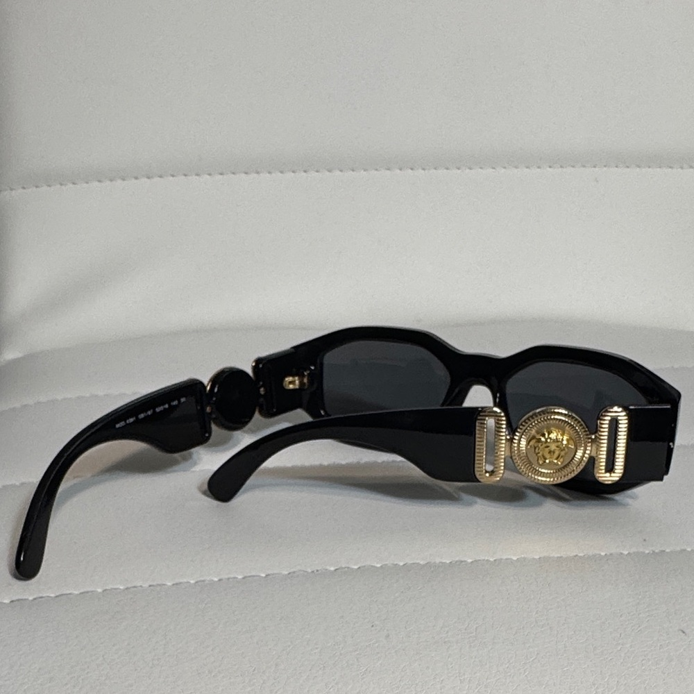 Versace Sleek Black Sunglasses with Gold Medusa Accent